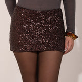 Minifalda de lentejuelas marrones, skort: una prenda versátil que combina el glamour de una minifalda con la comodidad de un short.  Perfecto para salidas nocturnas, fiestas o eventos especiales.