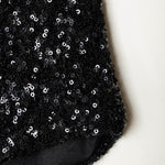 Detalle mini short de lentejuelas negras